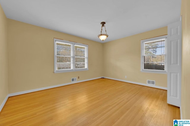 unfurnished room featuring light hardwood / wood-style floors