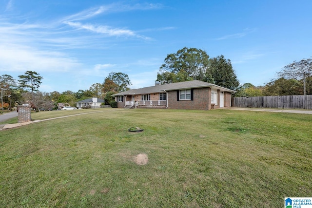 single story home featuring a front yard and a garage