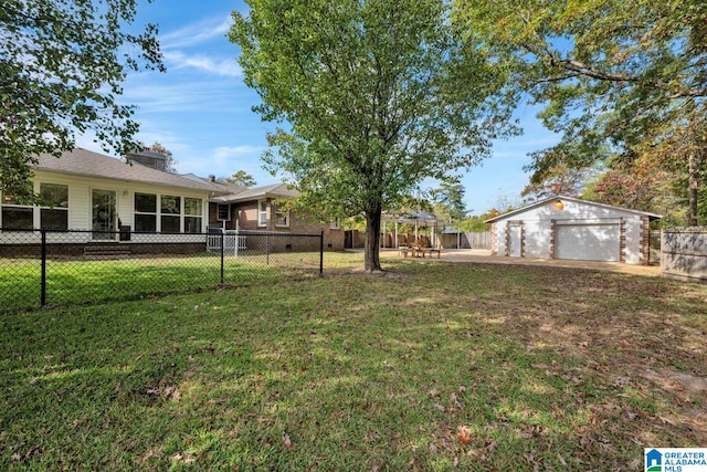 view of yard with an outbuilding and a garage