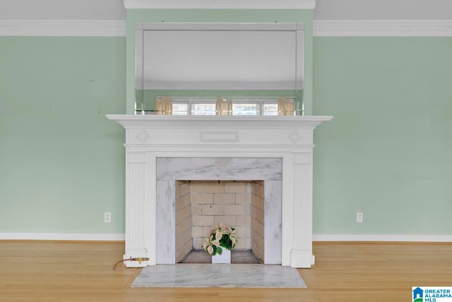 details with hardwood / wood-style flooring and crown molding