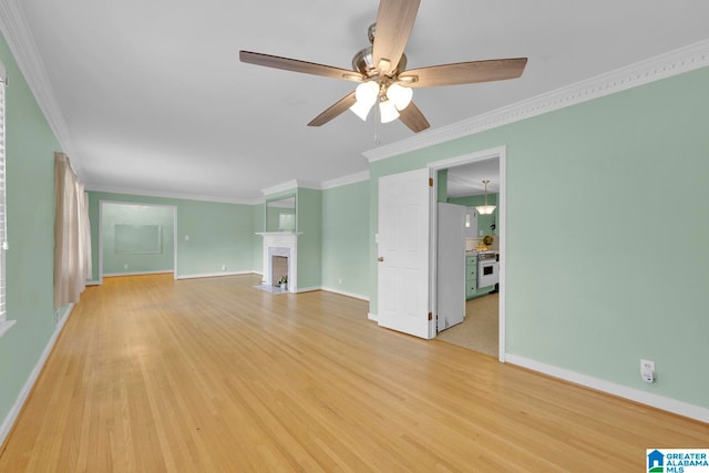 unfurnished living room with ceiling fan, a fireplace, crown molding, and light hardwood / wood-style flooring