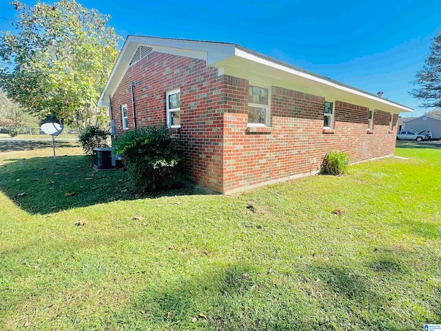 view of home's exterior with a lawn