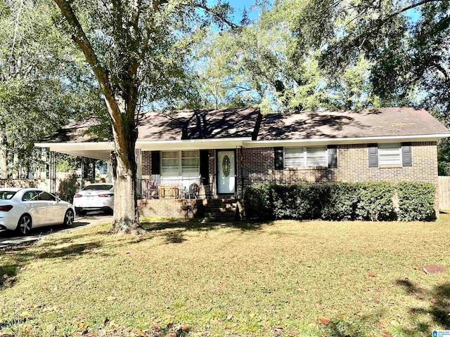 ranch-style house featuring a front yard and a carport