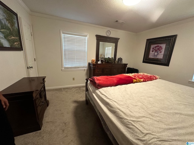 bedroom featuring carpet, a textured ceiling, and ornamental molding