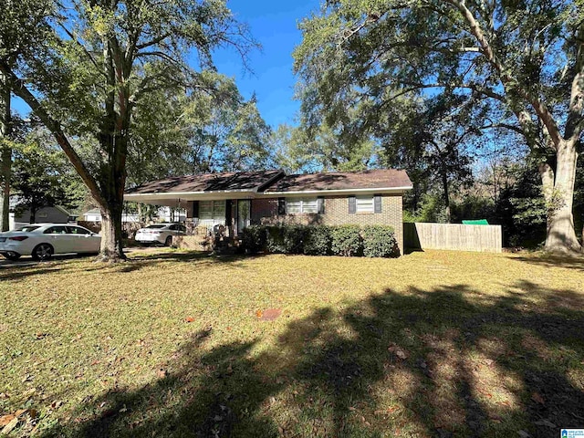 single story home with a front yard