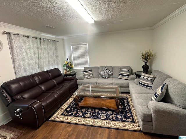 living room with hardwood / wood-style floors, a textured ceiling, and crown molding