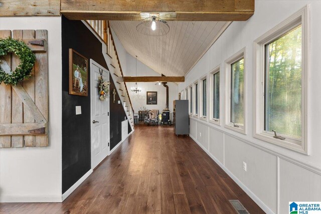 hall featuring wood ceiling, plenty of natural light, lofted ceiling with beams, and dark hardwood / wood-style floors