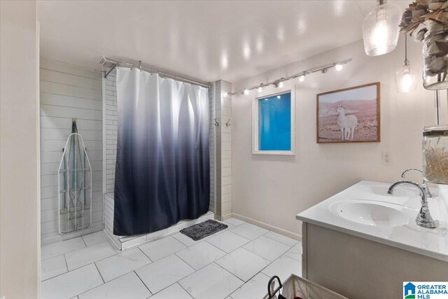 bathroom with vanity and curtained shower