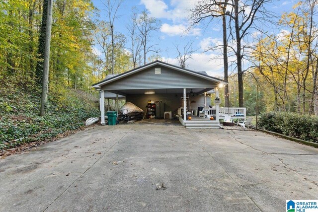 view of side of home with a wooden deck and a carport