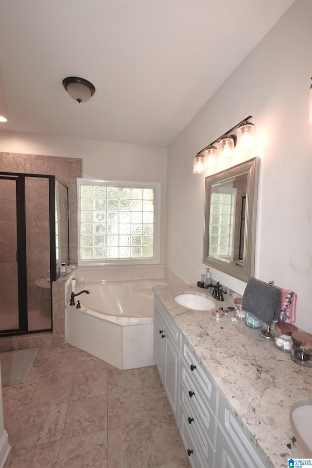 bathroom with separate shower and tub and vanity