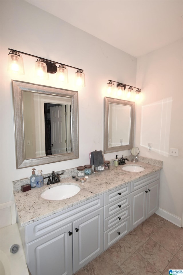 bathroom with tile patterned floors and vanity