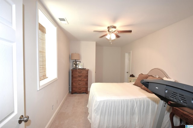 bedroom with light colored carpet and ceiling fan