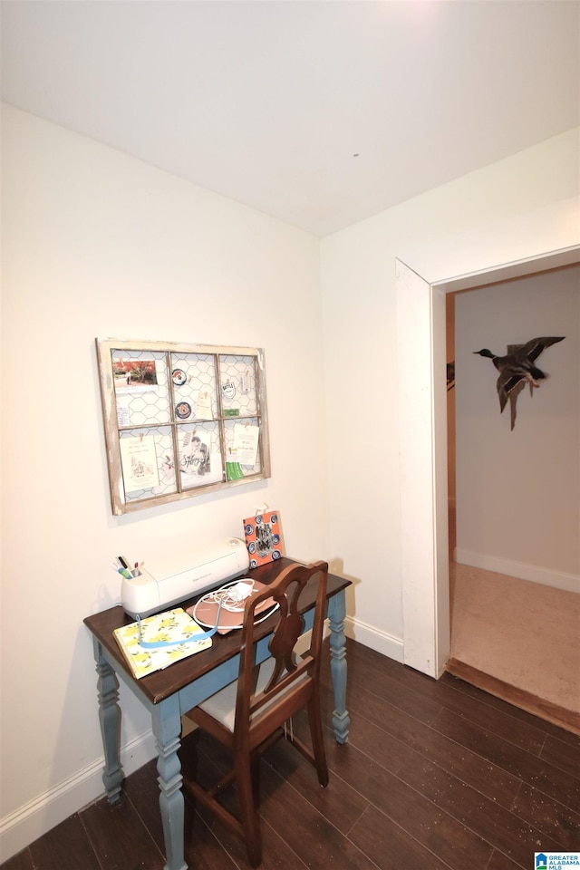 dining area featuring dark wood-type flooring