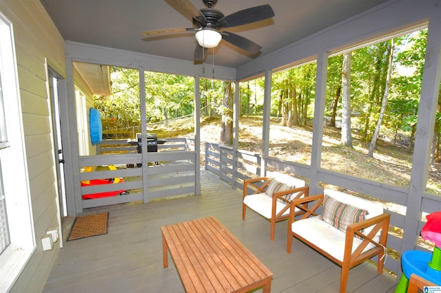 sunroom / solarium with ceiling fan