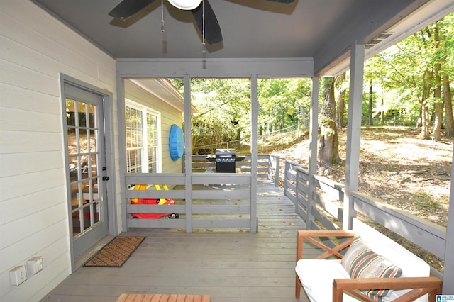 exterior space with ceiling fan