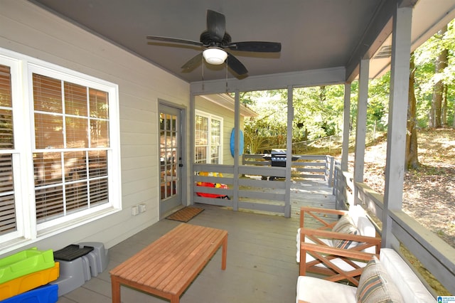 sunroom with ceiling fan and a healthy amount of sunlight