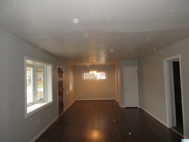 825 Goldwire St SW, Birmingham, AL 35211 - unfurnished room with wood finished floors, a chandelier, and baseboards