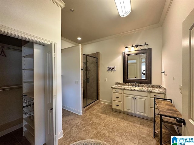 bathroom with vanity, an enclosed shower, and ornamental molding