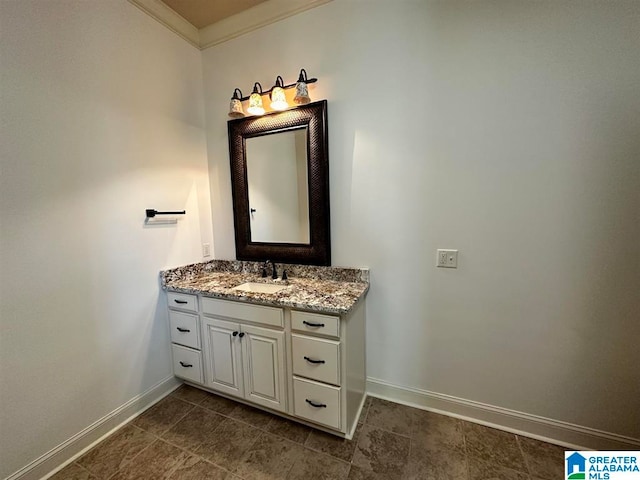 bathroom featuring vanity and ornamental molding