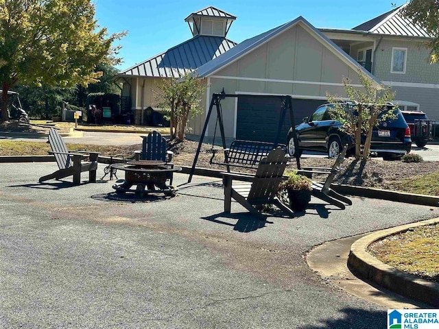 view of front facade with an outdoor fire pit