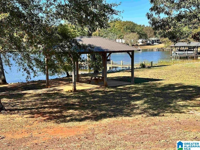 exterior space featuring a gazebo and a water view