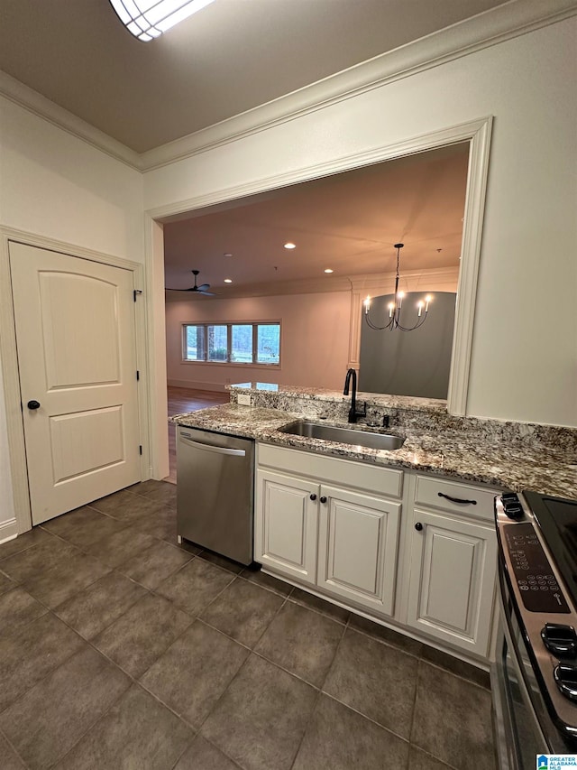 kitchen with white cabinets, ceiling fan with notable chandelier, sink, hanging light fixtures, and stainless steel appliances