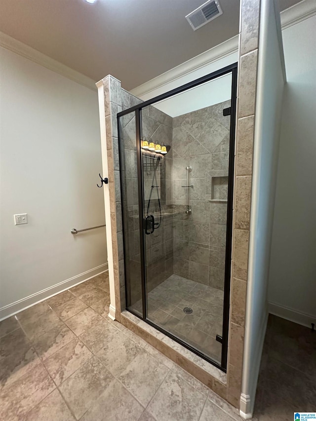 bathroom featuring crown molding and walk in shower