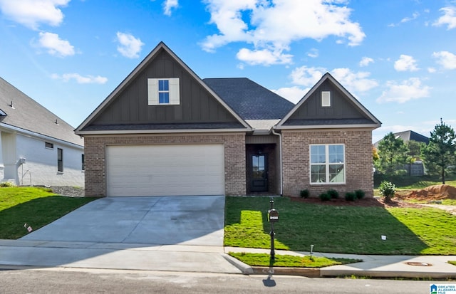 craftsman-style home with a front yard and a garage