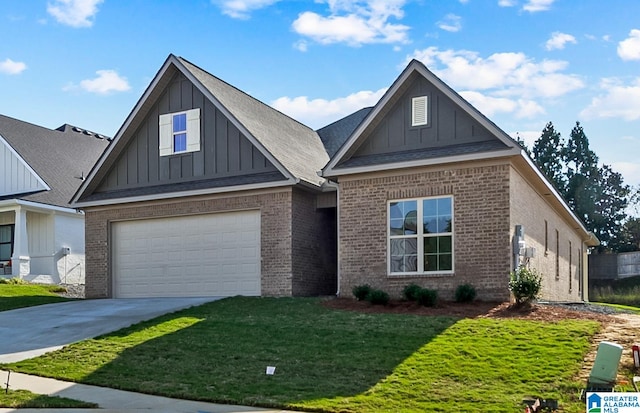 view of front of home with a front yard and a garage