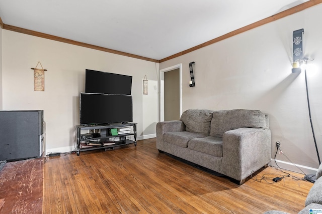 living room with hardwood / wood-style floors and crown molding