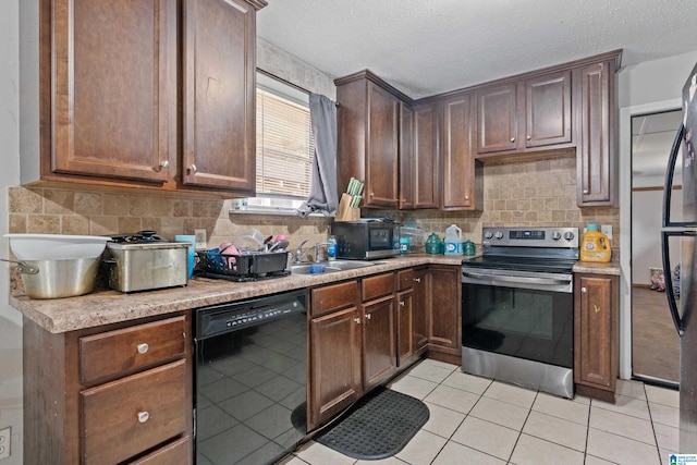 kitchen with tasteful backsplash, stainless steel range with electric stovetop, a textured ceiling, light tile patterned floors, and dishwasher