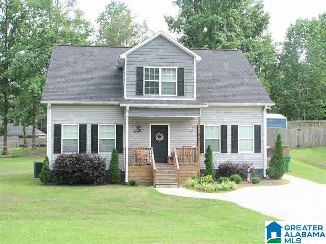 view of front of house with a porch and a front lawn