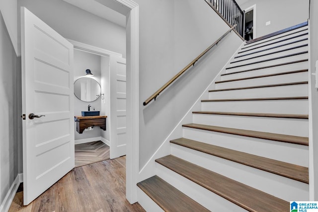 staircase featuring hardwood / wood-style floors