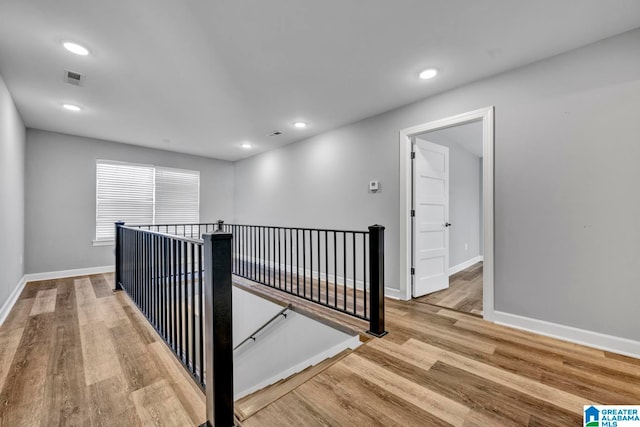 hall with light hardwood / wood-style flooring