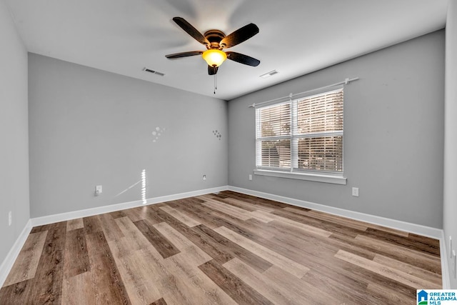 spare room with ceiling fan and light hardwood / wood-style flooring