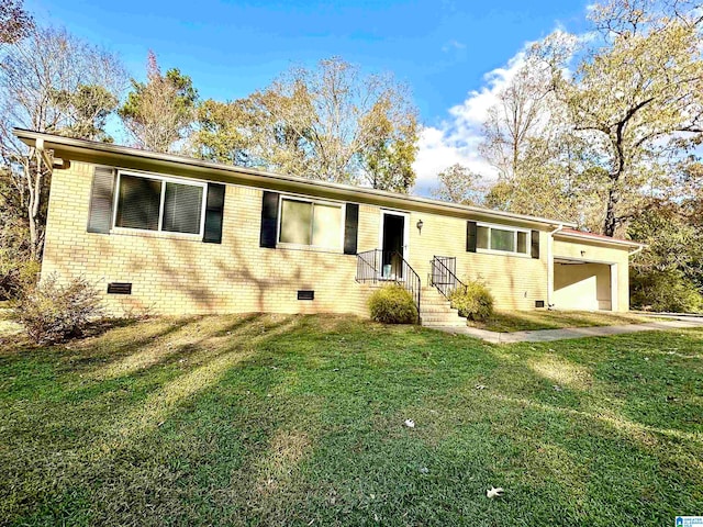 view of front facade with a garage and a front lawn