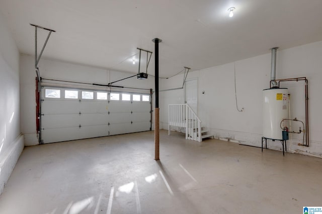 garage featuring a garage door opener and water heater