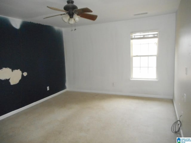 carpeted empty room with ceiling fan