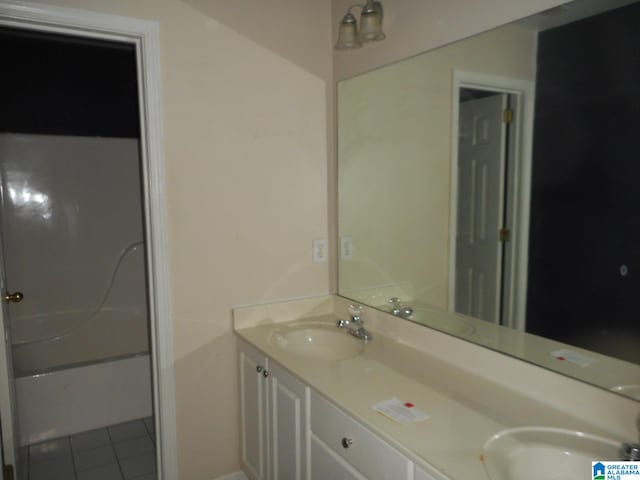 bathroom featuring tile patterned flooring and vanity