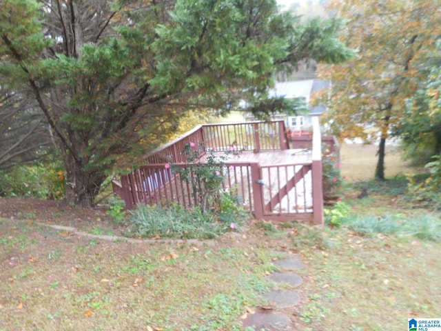 view of gate featuring a wooden deck