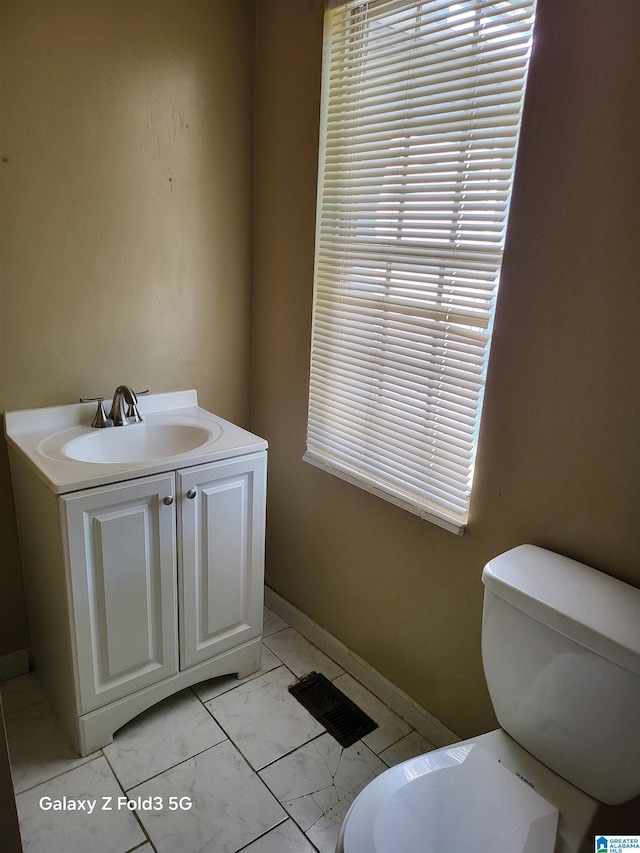 bathroom with vanity and toilet