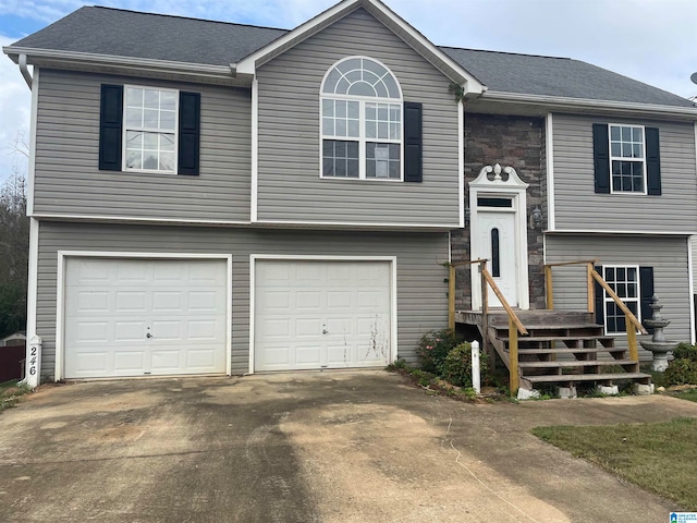 bi-level home featuring a garage