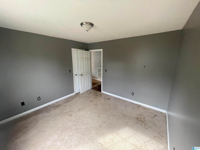 empty room featuring carpet floors