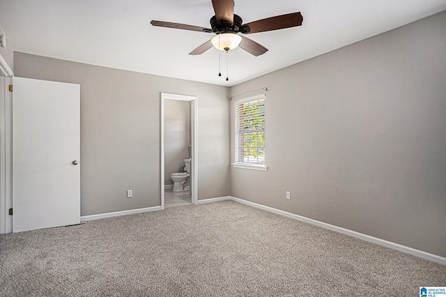 unfurnished bedroom with connected bathroom, ceiling fan, and carpet