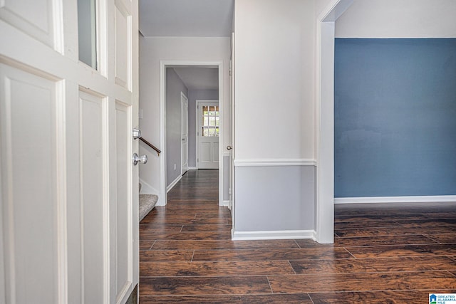 corridor featuring dark hardwood / wood-style floors