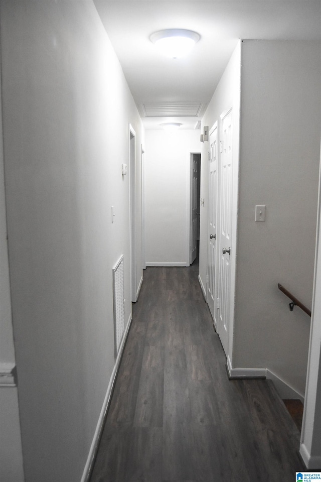 corridor featuring dark hardwood / wood-style floors