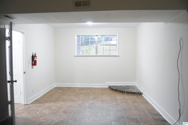 spare room with ornamental molding