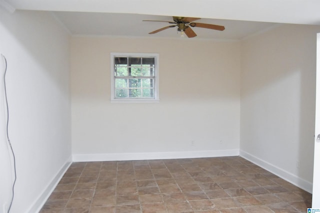 empty room featuring ceiling fan and ornamental molding