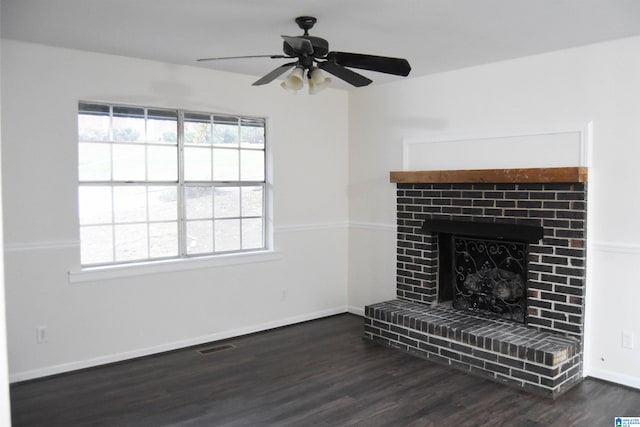 unfurnished living room with ceiling fan, a fireplace, and dark hardwood / wood-style floors