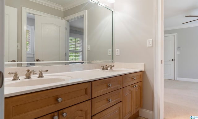 bathroom with vanity, ceiling fan, and crown molding